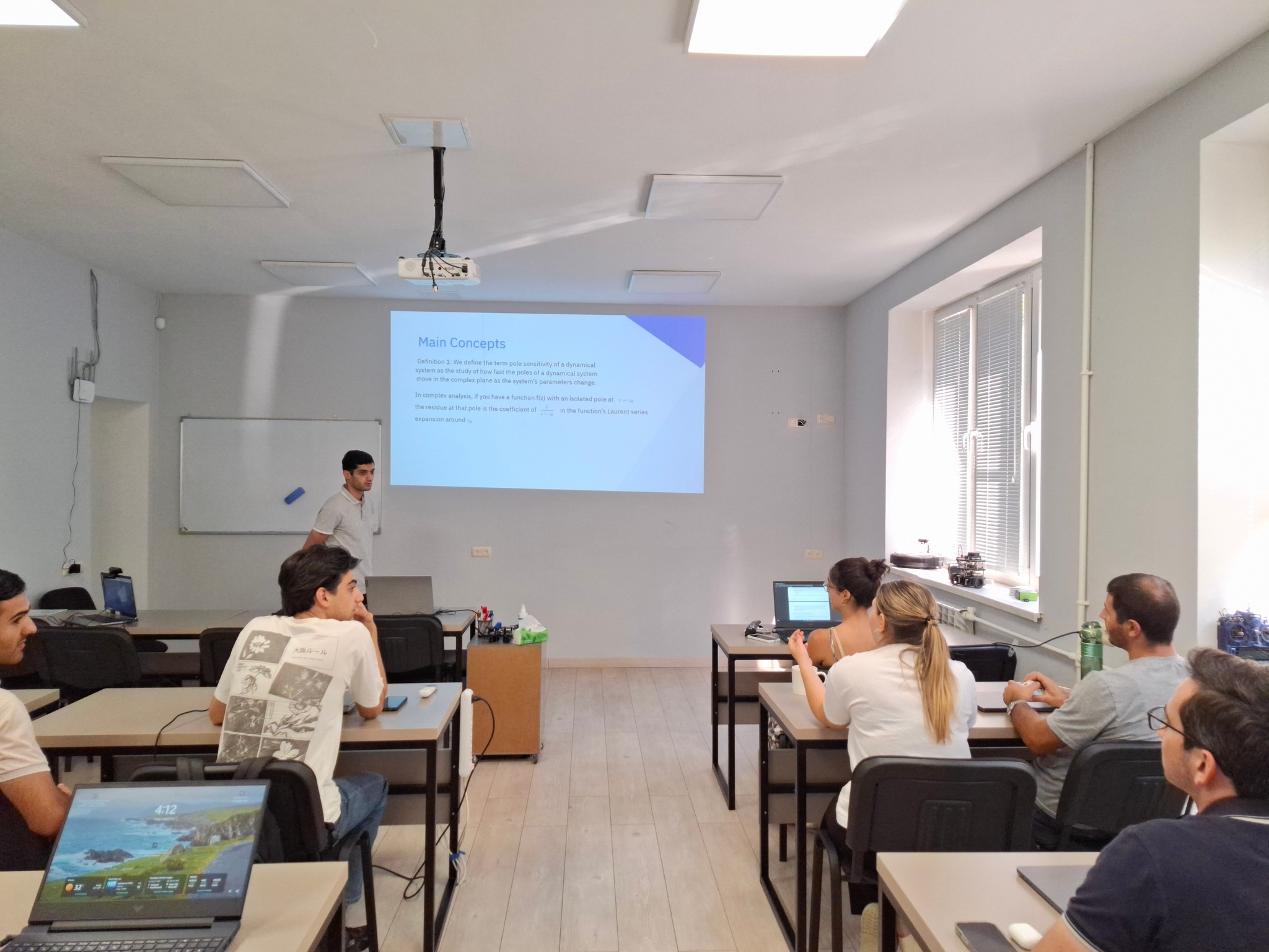 Seminar on Interpretation of Residues in the Partial Fraction Decomposition Applied to Pole Sensitivity Analysis and Root Locus Construction