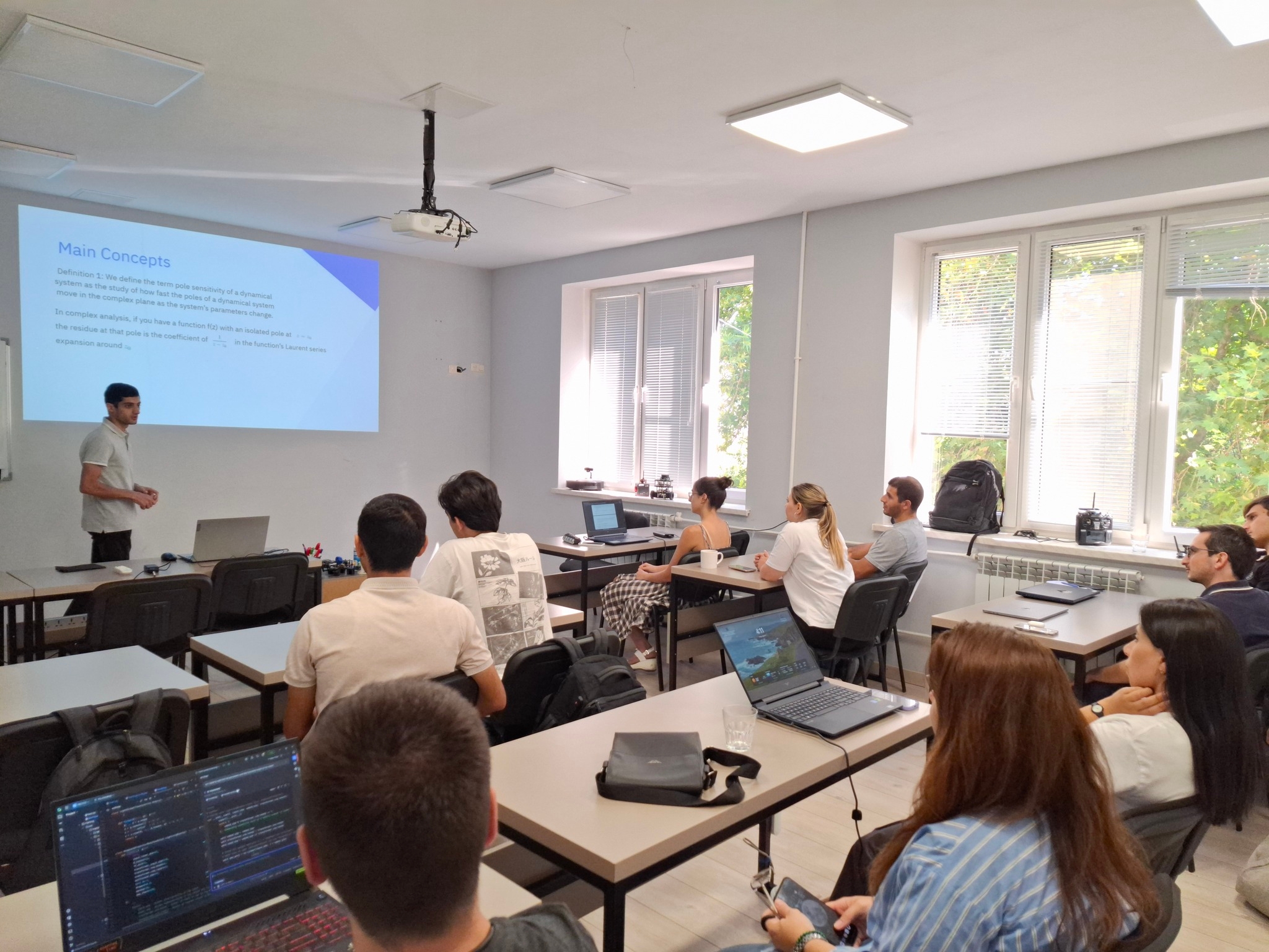Seminar on Interpretation of Residues in the Partial Fraction Decomposition Applied to Pole Sensitivity Analysis and Root Locus Construction